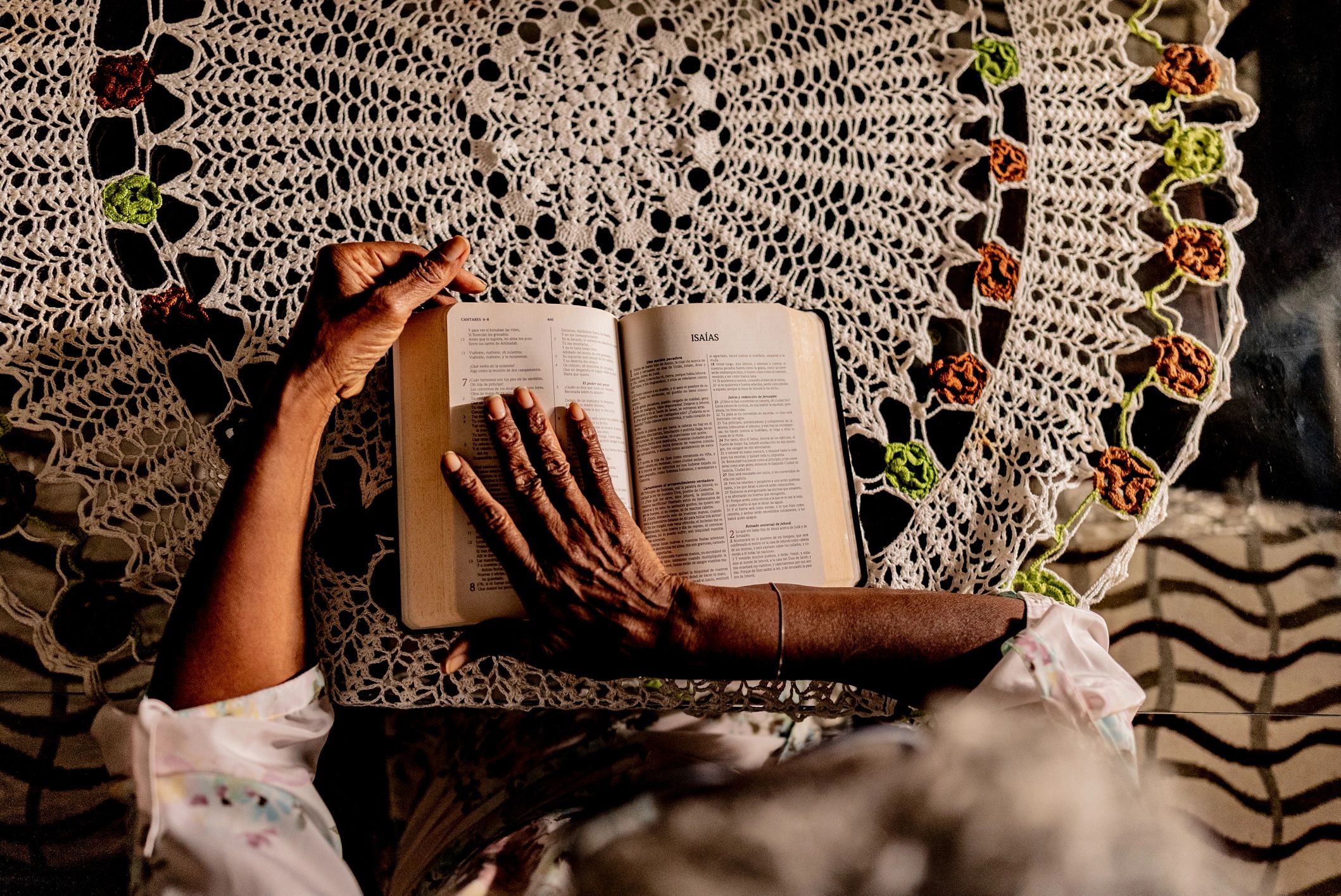 Person reading a Bible at home